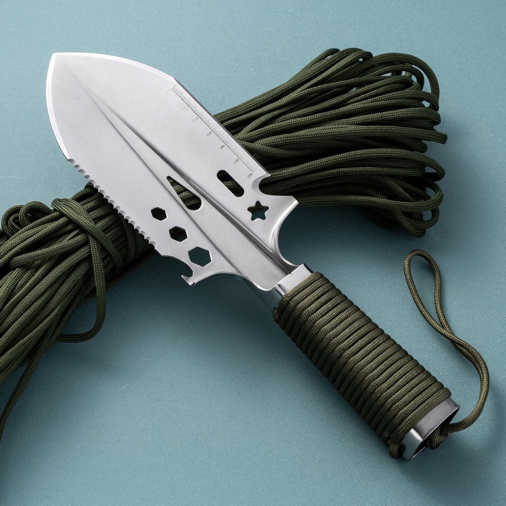 Nylon rope lanyard attached to handle of outdoor digging trowel