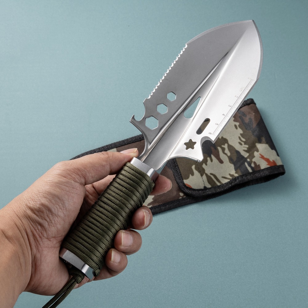 Garden trowel in hand with sheath, showing compact size