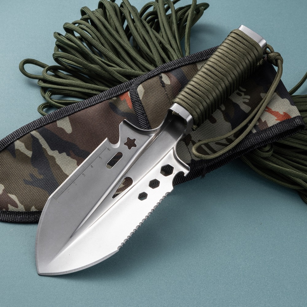 Garden trowel with camouflage sheath and lanyard, ready for outdoor use